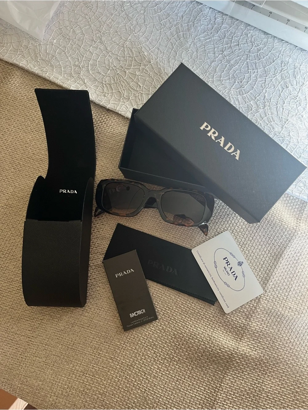 PradaTortoiseshell Sunglasses with Black Lenses